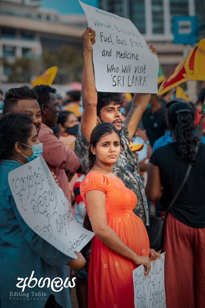 A young pregnant women in the protest 
