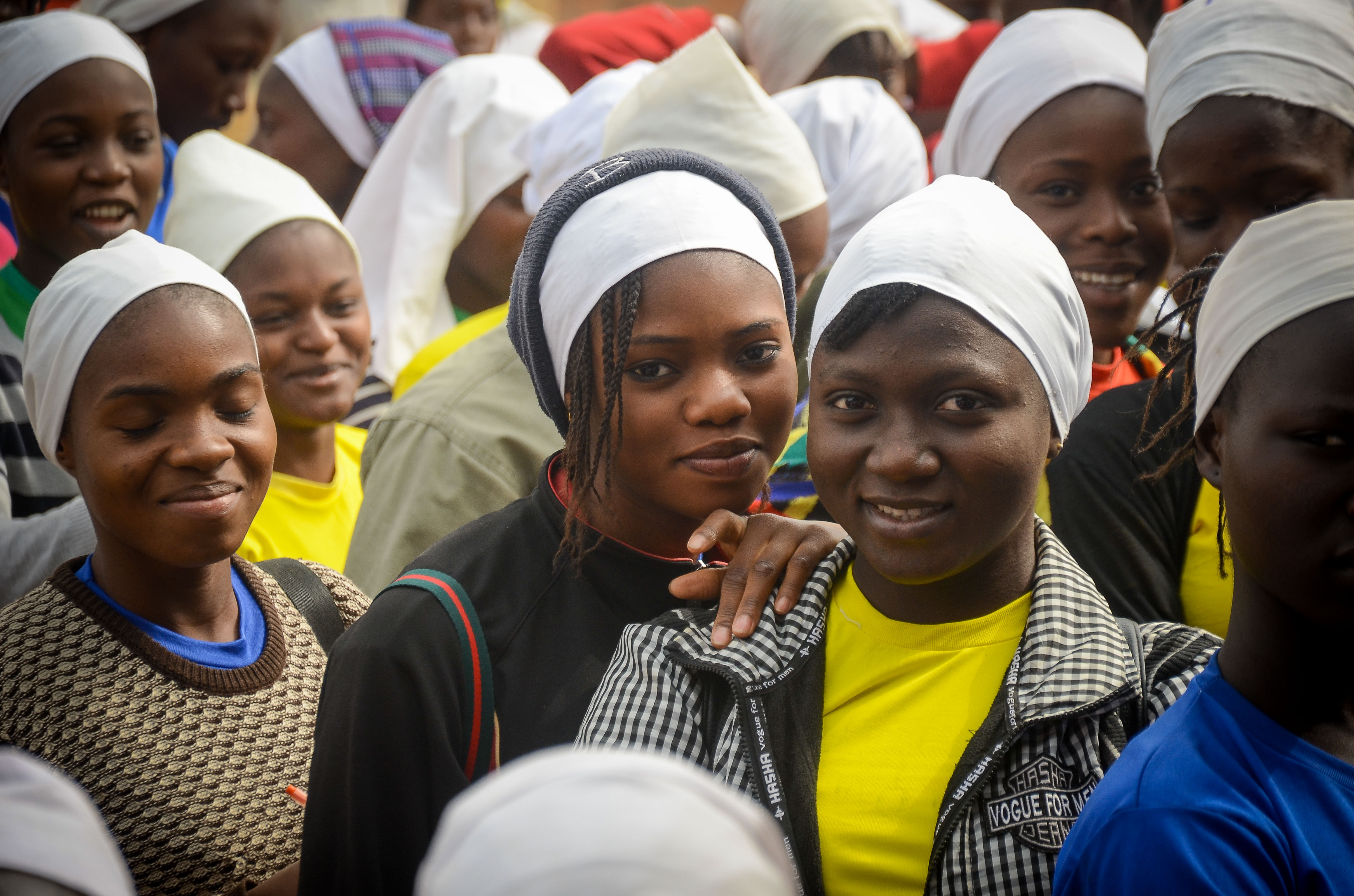 Smiling girls during the #TeachThem Project with SAWH Initiative.