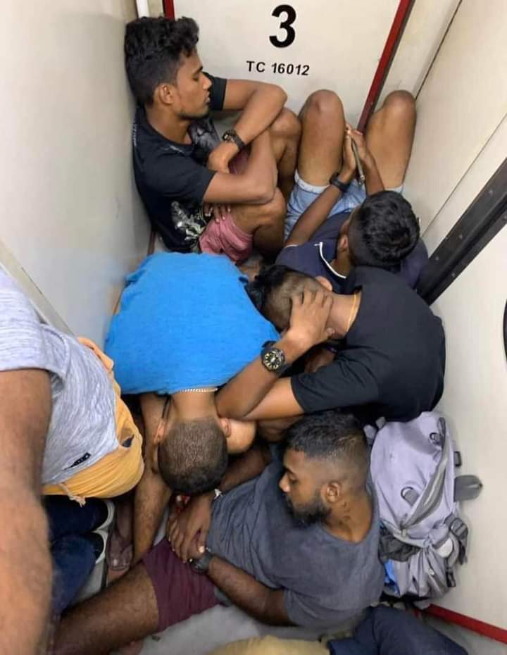 Young boys in nigh mail train. 