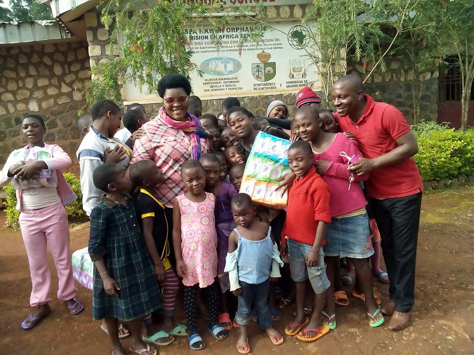 Here spending some quality time with children at Abango orphanage Bamenda Cameroon