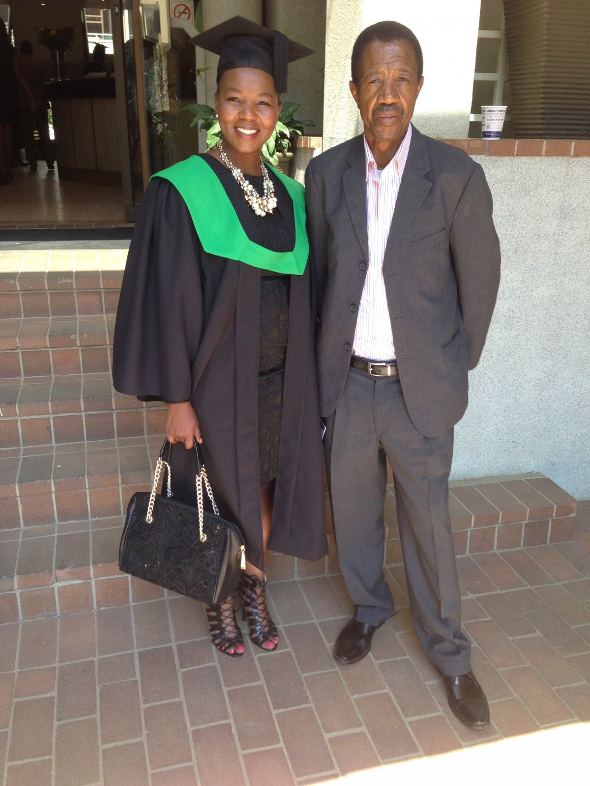 flanked by my father at Regenesys Business School.