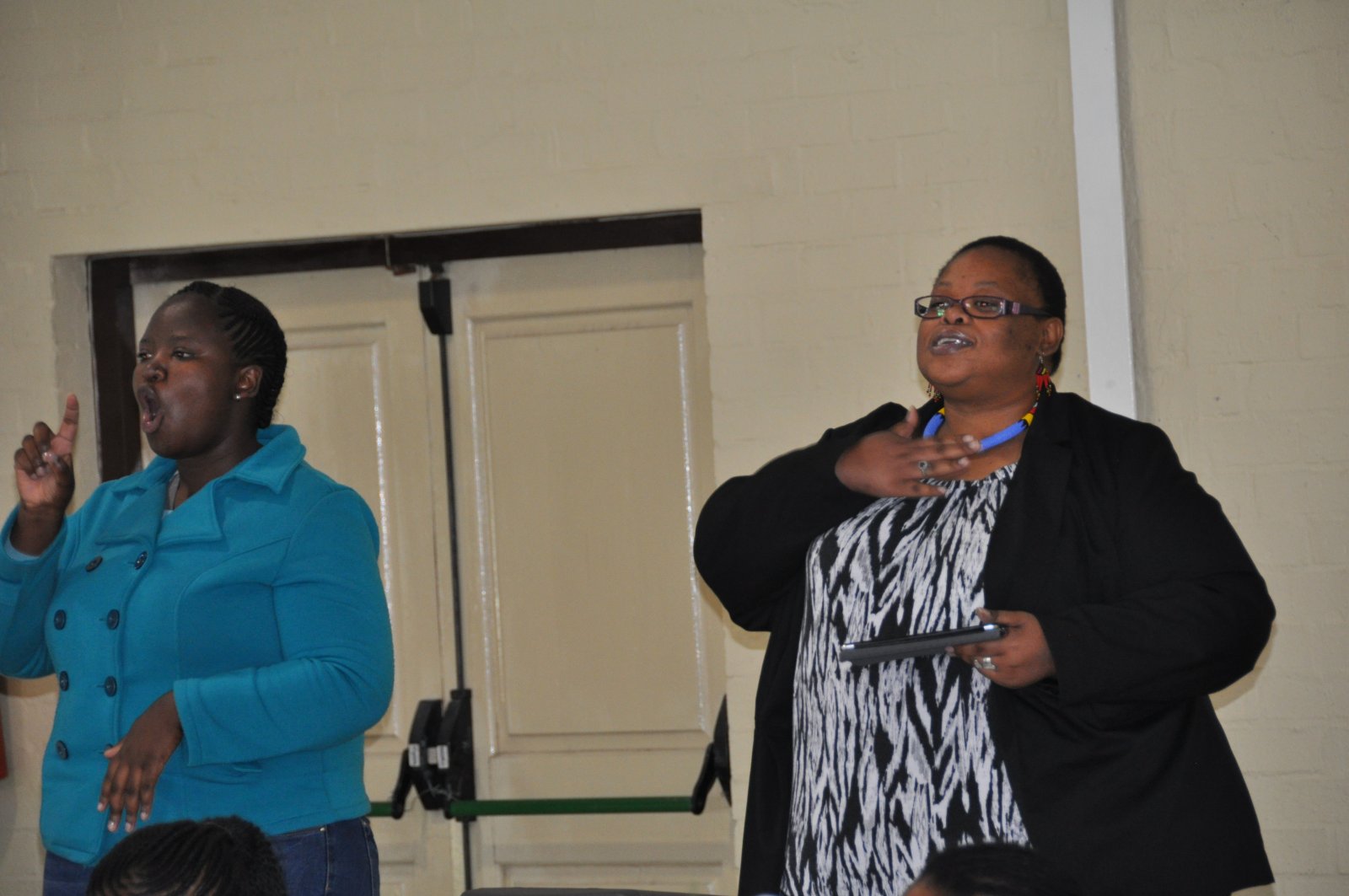 Ms. Mpho Ndebele (R)  Sign Language Interpreter: Ms. Unathi Kave (L)