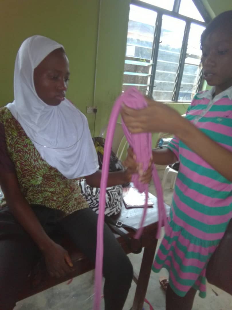 Girls learning to make table mat