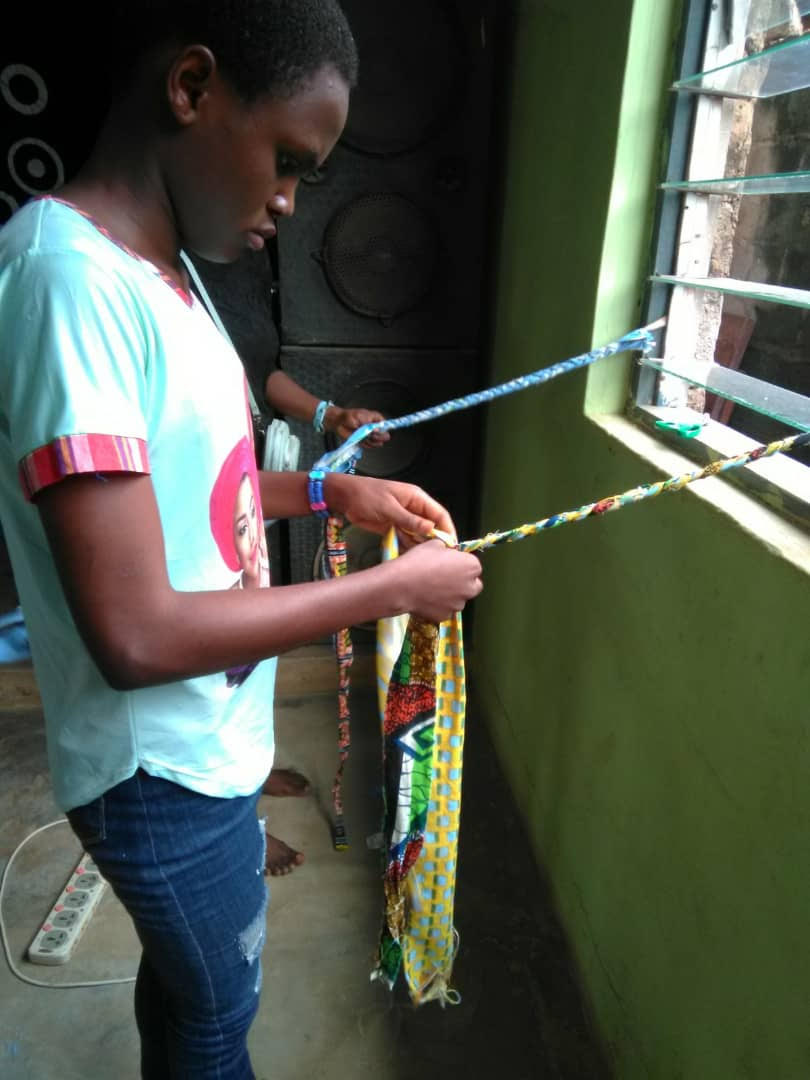 Blessing Chukwu, very busy weaving from fabrics