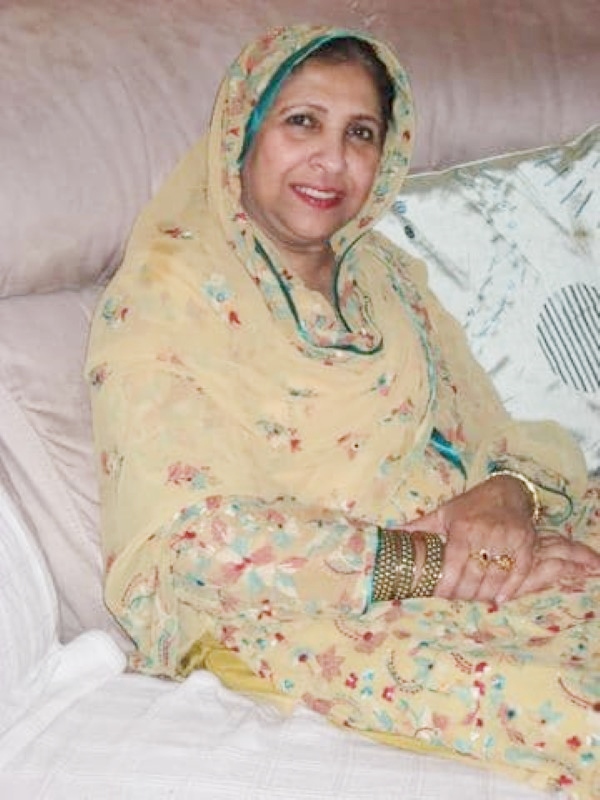 My beloved mother Mrs Meshar Mumtaz Bano modelling fairtrade gold cuffs produced by Noah's Ark International, Moradabad, India.  Mum was a staunch supporter of my fairtrade work and she was always happy to model fairtrade jewellery for me.  This photograph was taken 3 months after her breast cancer diagnosis.   Location: Manchester, UK - June 2012