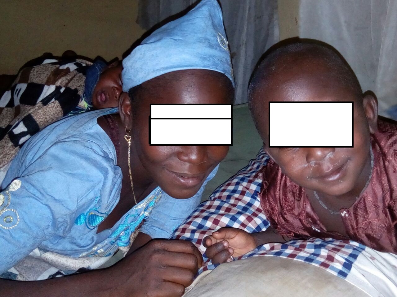 Faces distorted to protect the identity of the mother and the son who is underage.