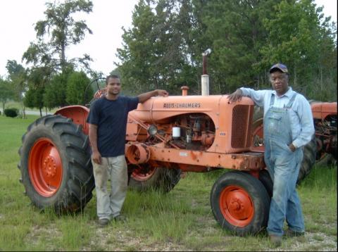Ben Burkett on his farm in Petaluma, Mississippi, with his great-nephew. Photo courtesy of Grassroots International.